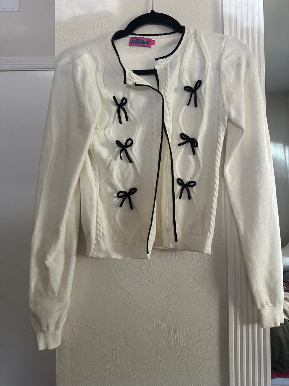Edikted Ivory Cardigan with Black Bow Trim